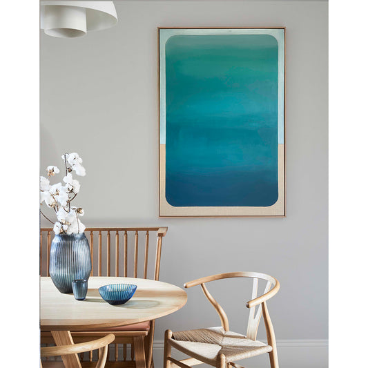 Dining room with a table, chairs, and a large abstract painting on the wall.