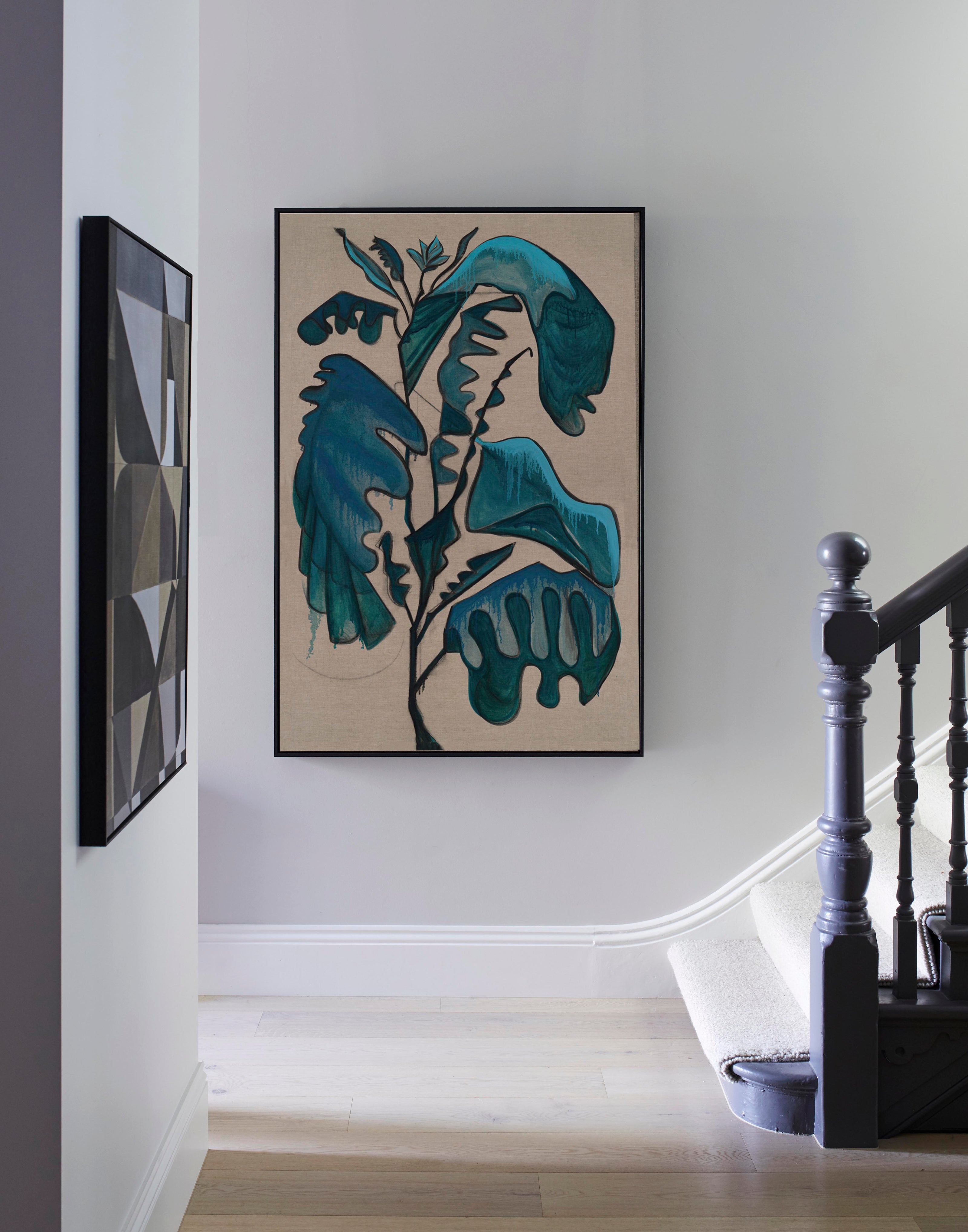 Studio Elwood “Terracotta Leaf” — framed botanical artwork with sculptural teal leaves on linen canvas, styled in a bright contemporary hallway with soft natural light.