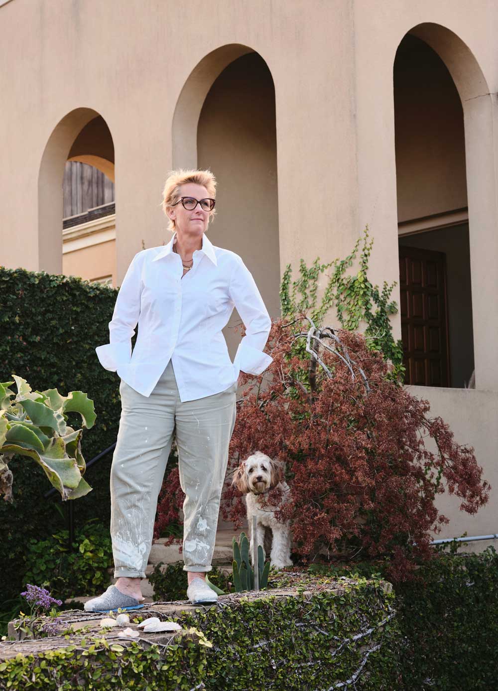 The founder and artist of Studio Elwood's abstract wall art in an outside setting